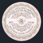 Vintage French Hand Pomade Cuticle Cream with Bee Classic Round Sticker<br><div class="desc">This dainty textured rose product label will make your value-added beekeeping products stand out from the rest. An 1800's vintage French filagree design serves as a backdrop to the heraldic bee illustration in the centre of the label. Your Apiary name and location is displayed in curved text across the top...</div>