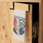 Vintage HOGWARTS™ Stamped Crest Kitchen Towel<br><div class="desc">Show your house pride in bold, vintage-inspired style with this striking Hogwarts™ crest design. Featuring graphic silhouettes representing the four iconic houses — Gryffindor™, Slytherin™, Hufflepuff™, and Ravenclaw™ — this artwork blends classic symbolism with a modern, retro aesthetic. Each house emblem is set within a clean, color-blocked shield, creating a...</div>
