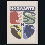 Vintage HOGWARTS™ Stamped Crest Magnet<br><div class="desc">Show your house pride in bold, vintage-inspired style with this striking Hogwarts™ crest design. Featuring graphic silhouettes representing the four iconic houses — Gryffindor™, Slytherin™, Hufflepuff™, and Ravenclaw™ — this artwork blends classic symbolism with a modern, retro aesthetic. Each house emblem is set within a clean, color-blocked shield, creating a...</div>