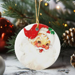 Vintage Jolly Santa Claus Christmas Ceramic Ornament<br><div class="desc">This Jolly Santa is sure to bring a festive vintage feel to your Christmas.  Oranment feastures a rosy-cheeked Santa Claus in his red hat and a sprig of mistletoe.</div>
