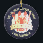 vintage lobster fork knife chalkboard Christmas Ceramic Ornament<br><div class="desc">Vintage,  retro,  shabby or antiqued style lobster emblem with fork,  knife and 5 star flag with scattered snowflakes on a chalkboard background on 'from the kitchen of' stickers or food label gift tags,  greeting cards for seafood vendors,  chefs and catering,  fun tree ornaments for foodies and more.</div>