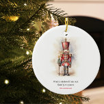 Vintage Nutcracker & Merry Christmas Ceramic Ornament<br><div class="desc">A beautifully illustrated vintage-style Nutcracker soldier, resplendent in his classic attire, stands tall, holding a Merry Christmas banner. The rich, warm colours and intricate details evoke a sense of yuletide nostalgia, making it a perfect choice for those who appreciate the classic holiday aesthetics. May your holiday season be filled with...</div>