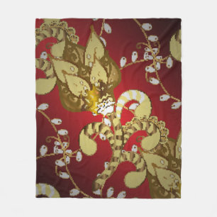 Vintage ornamental pattern on a red, yellow and b fleece blanket