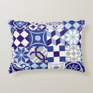 Vintage patchwork background with traditional blue accent pillow