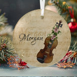 Vintage Personalized Violin Christmas Tree  Glass Ornament<br><div class="desc">Grace your Christmas tree with the elegance of our Vintage Personalized Violin Christmas Tree Glass Ornament. Crafted with care, this ornament features a charming design of a violin against a vintage sheet music background. Elegant poinsettia flowers adorn the neck of the violin. Personalize with a name displayed in a calligraphy...</div>