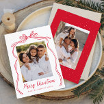 Vintage Red Bow Merry Christmas 2 Photo Holiday Card<br><div class="desc">Celebrate the holiday season with this charming Christmas card featuring your family's photo framed by a festive red bow and ribbon on a crisp white background. "Merry Christmas" is elegantly written in a charming red handwritten script, with space to personalize your family name below. The back of the card showcases...</div>