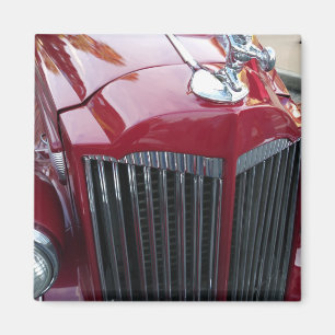 vintage red car with chrome hood ornament magnet