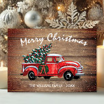 Vintage Red Truck Merry Christmas Rustic Wood Holiday Card<br><div class="desc">Send a unique customized rustic holiday photo greeting card to your family and friends that they'll love. This design features a vintage red pickup truck carrying a Christmas tree in the back on a background of faux weathered wood Above the truck in white hand lettered script typography it reads "Merry...</div>