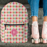 Vintage Retro Diamond Pattern Pink Monogram Printed Backpack<br><div class="desc">This stylish backpack features a vintage / retro diamond pattern in shades of berry red, magenta pink, light pink, gold, mint green, and light aqua blue. A monogram text template is included for simple personalization - customize it or remove the template and circle if no monogram is desired. Great for...</div>