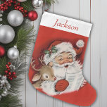 Vintage Retro Santa And Reindeer Personalized Large Christmas Stocking<br><div class="desc">This Vintage Retro Santa and Reindeer Personalized Christmas Stocking is the perfect blend of nostalgia and charm, bringing a touch of classic holiday spirit to your festive decor. This stocking features a delightful, old-fashioned illustration of Santa Claus and his trusty reindeer, reminiscent of cherished childhood memories. The vibrant colours and...</div>
