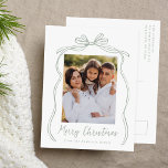 Vintage Sage Green Bow Merry Christmas Photo Holiday Postcard<br><div class="desc">Celebrate the holiday season with this charming Christmas postcard featuring your family's photo framed by a festive sage green bow and ribbon on a crisp white background. "Merry Christmas" is elegantly written in a charming sage green handwritten script, with space to personalize your family name below. The back of the...</div>
