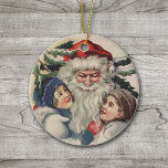 Vintage Santa Claus Christmas Ornament<br><div class="desc">Here's a heart warming Victorian era image of Santa hugging two small children. The back side of this beautiful ornament is in Christmas red,  with the customizable words "Joyful Christmas 2012". Celebrate Christmas the old fashioned way with this vintage art image.</div>