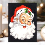 Vintage Santa Claus Face Christmas Holiday Postcard<br><div class="desc">Send nostalgic holiday greetings with this charming vintage Santa Claus face Christmas postcard. Featuring a classic illustration of Santa's jolly face with his iconic red hat and holly, this postcard captures the essence of traditional Christmas cheer. Perfect for spreading festive joy to friends and family, this postcard evokes warm memories...</div>