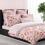 Vintage Santa Claus Pink Plaid Christmas Duvet Cover<br><div class="desc">Celebrate the festive season with the Pink Vintage Santa Claus Pink Plaid Christmas Duvet Cover. This charming duvet cover features a delightful pattern of vintage Santa Claus faces and snowflakes against a rich pink background, evoking a nostalgic holiday spirit. The reverse side showcases a classic pink and white plaid, adding...</div>