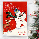 Vintage Snowman And Deer Custom Christmas Holiday Card<br><div class="desc">This adorable vintage retro Christmas card features a snowman walking through the snow carrying a wrapped gift in one hand and a candy cane in the other with a little deer following behind and playfully licking the end of the candy cane. Personalize by adding your name or family name at...</div>