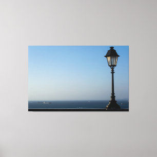 Vintage Street Lamp Overlooking Calm Blue Ocean Ho Canvas Print