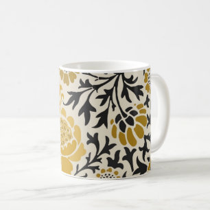 Vintage-style yellow and black floral pattern coffee mug