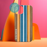 Vintage Surfboard Stripes - Custom Name iPhone 16 Case<br><div class="desc">A colourful, retro stripe design in blue and orange on a faux wood print background. A vintage surfboard stripe design with a beach and surf look. Add your name or monogram to make this a personal phone case that will stand out amongst your friends. The name is a thin serif...</div>