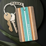 Vintage Surfboard Stripes - Subtle Wood Background Keychain<br><div class="desc">A colourful, retro stripe design in aqua blue and orange on a faux wood print background. A vintage surfboard stripe design with a beach and surf look. Add your name or monogram to make this a personal phone case that will stand out amongst your friends. The name is a thin...</div>