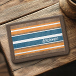 Vintage Surfboard Stripes - Subtle Wood Background Trifold Wallet<br><div class="desc">A colourful,  retro stripe design in blue and orange on a faux wood print background. A vintage surfboard stripe design with a beach and surf look. Add your name or monogram to make this a personal item that will stand out amongst your friends. The name is a chunky font.</div>