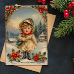 Vintage Sweet Girl Standing Christmas Holiday Card<br><div class="desc">Imagine yourself to a charming winter wonderland with this Vintage Christmas Card. Adorned with a delightful image of a sweet girl standing amidst holly leaves and red berries, this card shares the warmth of holiday season. The background features cozy houses and festively decorated Christmas trees. The perfect Christmas card for...</div>