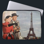 Vintage Tourists at Eiffel Tower, Paris Vacation Laptop Sleeve<br><div class="desc">Vintage illustration travel and transportation image featuring vacationing newlyweds sightseeing in Paris, France with the Eiffel Tower in the background. A love and romance design with a man and woman on a romantic vacation, a couple in the city of lights on their honeymoon. She is holding a map of the...</div>