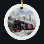 Vintage Train Winter Christmas Scene Ceramic Ornament<br><div class="desc">Ornament with a photograph of a snowy winter landscape with snow-covered pine trees. A red, gold and black old-fashioned train travelling through the wilderness. Conjures up thoughts of coming home for Christmas.</div>