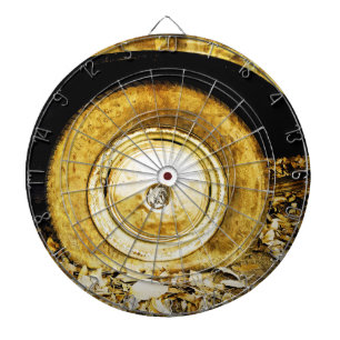 Vintage wheel of a old car on autumn leaves dartboard