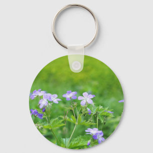 Violet flowers in the field keychain