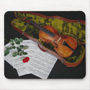 Violin and red rose on black background mouse pad