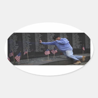 Visiting The Vietnam Memorial Wall, Washington DC. Oval Sticker