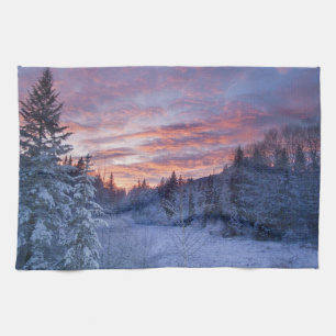 Vivid sunset paints the sky above wintery kitchen towel