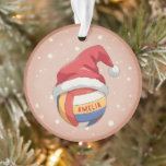 Volleyball Ball with Red Santa Hat Name Christmas Ornament<br><div class="desc">Volleyball Ball with Red Santa Hat Name Christmas Ornament. Celebrate the holidays with this charming personalized volleyball ornament! Featuring a festive volleyball wearing a Santa hat, set against a delicate pink background, this keepsake is perfect for any player, fan, or coach. Customize it with a name like "Amelia" to make...</div>