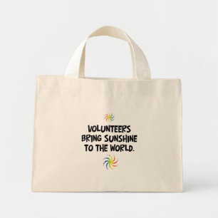 Volunteers bring sunshine to the world mini tote bag
