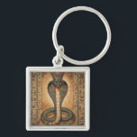 Wadjet – Ägyptische Schlangengöttin´7 Keychain<br><div class="desc">Wadjet ist eine Kobra-Göttin aus der ägyptischen Mythologie und Schutzgöttin der Pharaonen sowie von Unterägypten. Sie steht für Schutz,  Macht und königliche Autorität.</div>