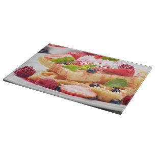 Waffle cake with fresh berry fruit cutting board