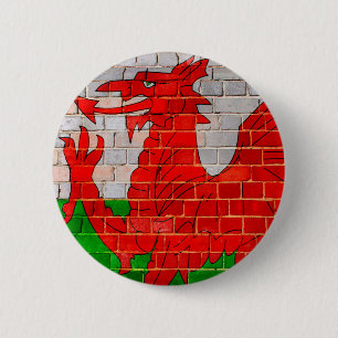 Wales flag on a brick wall 2 inch round button