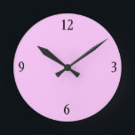 Wall Clock in Pink<br><div class="desc">This pink wall clock will look fabulous with more of the matching pillows,  serving trays,  picture frames and light switches in this store in the same bubble gum pink colour.</div>