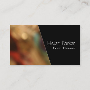 Warm, blurred photo beside solid black diagonal business card