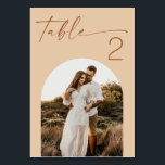 Warm Peach Sand Wedding | Modern Script Arch Photo Table Number<br><div class="desc">A wedding table number card with space for your photo, combining a clear table number with a personal detail. The layout keeps everything easy to read, so guests can quickly find their table without confusion. The photo adds a personal touch without making the design feel busy. It works naturally on...</div>