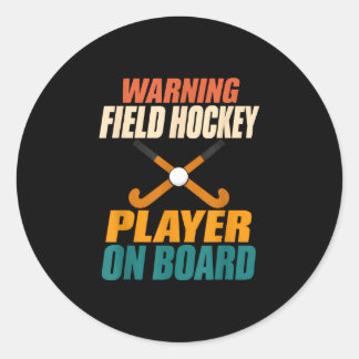 Warning field hockey player on board field hockey classic round sticker