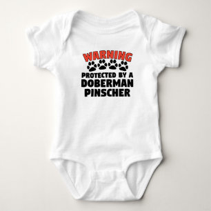 Warning Protected By A Doberman Pinscher Baby Bodysuit