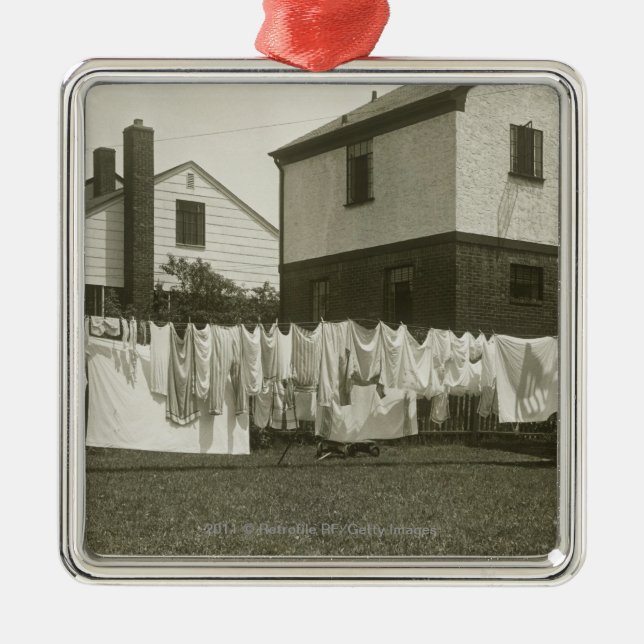 Washing line outside houses metal ornament (Front)