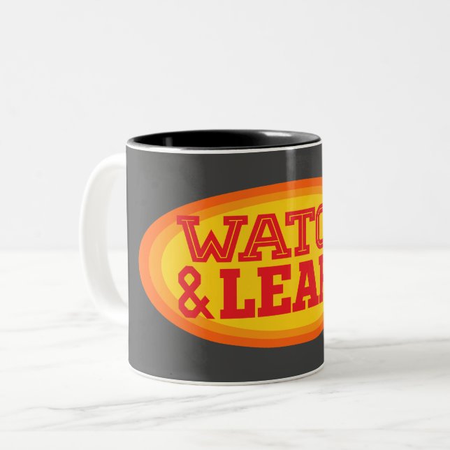 Watch & Learn Radial Oval Two-Tone Coffee Mug (Front Left)