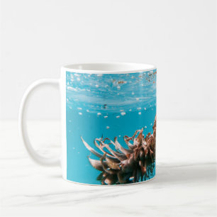 Water droplets on brown plant coffee mug