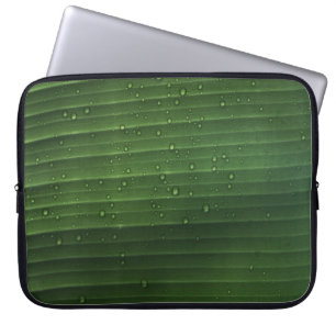 Water droplets on green leaf laptop sleeve
