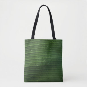 Water droplets on green leaf tote bag