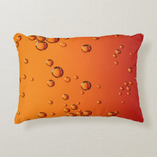 Water droplets on orange surface accent pillow