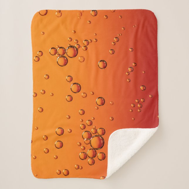 Water droplets on orange surface sherpa blanket (Front)