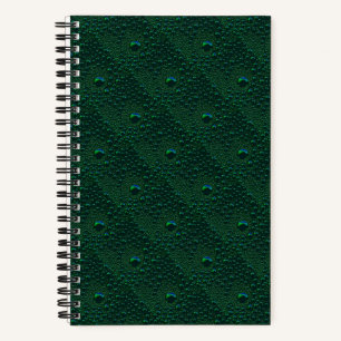 Water Drops on Green Metal Notebook